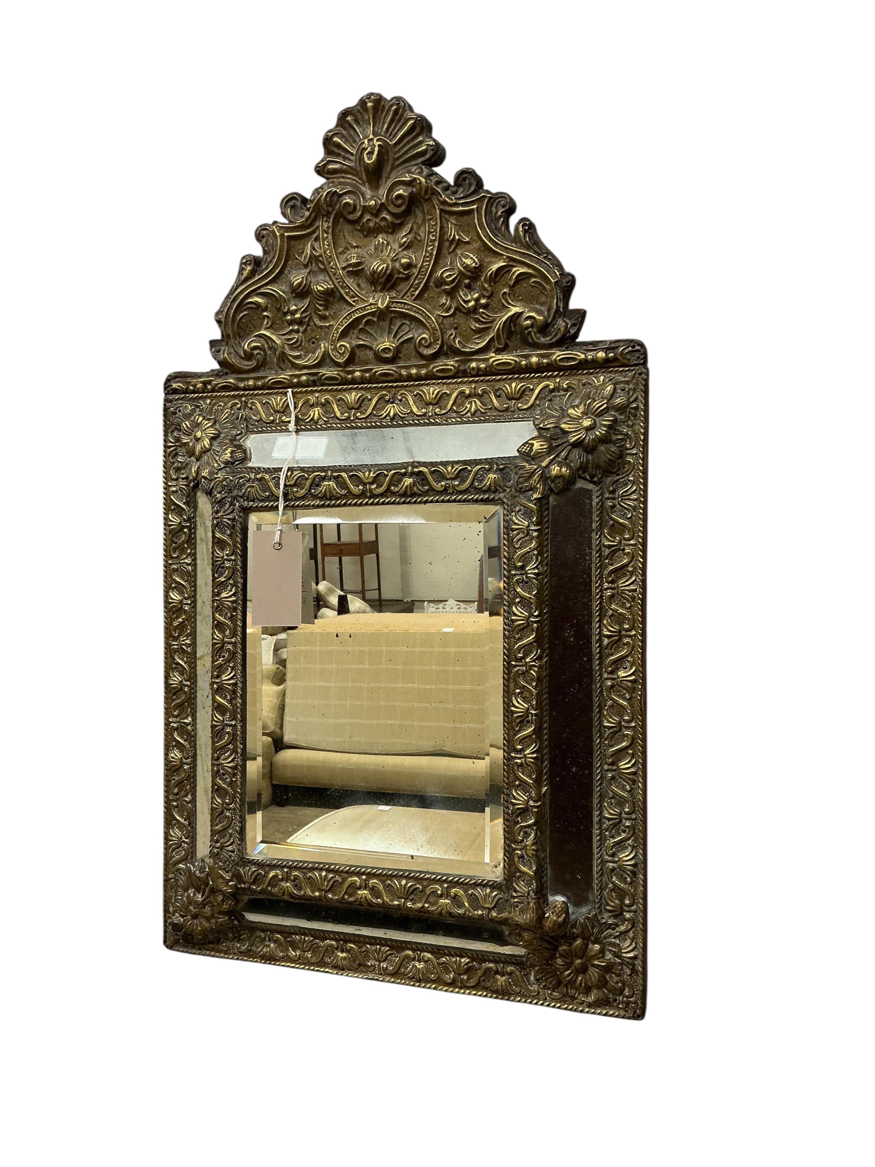 A small 19th century French embossed brass wall mirror, width 38cm, height 64cm